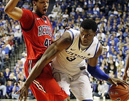Kentucky's Terrence Jones (right), who scores 15 points and grabs 11 rebouds, drives past Mississippi's Jelan Kendrick. (AP)