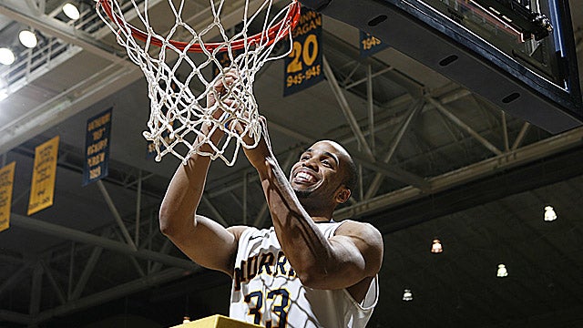 Jewuan Long cuts down the net, celebrating the Racers' Ohio Valley Conference title. (US Presswire)