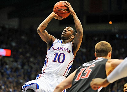 Tyshawn Taylor of the No. 4 Jayhawks takes a shot during the first half against the Red Raiders. (US Presswire)