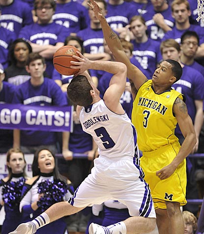 Northwestern's Dave Sobolewski tries to shoot over Michigan guard Trey Burke in the second half.  (AP)