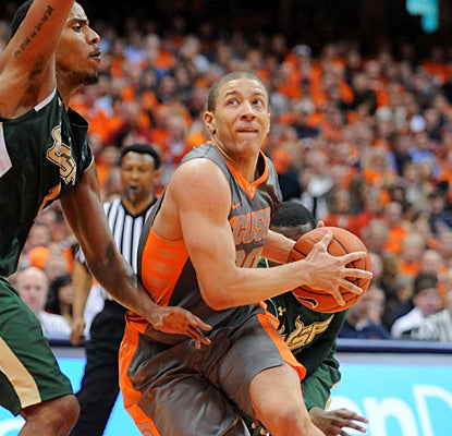 Syracuse's Brandon Triche drives past South Florida's Ron Anderson Jr. during the second half.  (US Presswire)