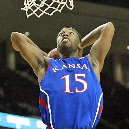 Kansas' Elijah Johnson dunks for two of his team-high 21 points against Texas A&M. (US Presswire)