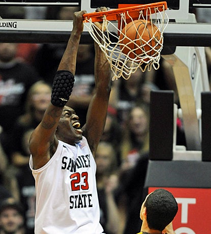 DeShawn Stephens slams home two of his eight points as San Diego State outlasts Wyoming in OT. (US Presswire)