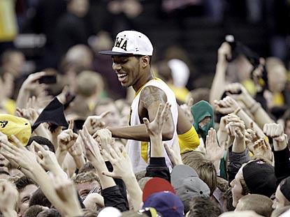 Hawkeyes sophomore Devyn Marble gets a hero's sendoff after his game-high eight assists help Iowa knock off Wisconsin.  (AP)