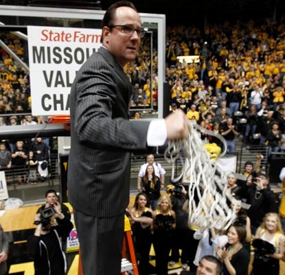 Wichita State coach Gregg Marshall cuts down the nets in celebration of the Missouri Valley Conference regular season title.  (AP)