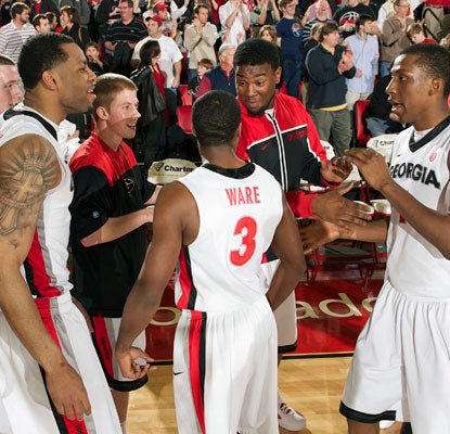 Struggling for most of the season, Georgia players celebrate a big win over 12th-ranked Florida in Athens.  (US Presswire)