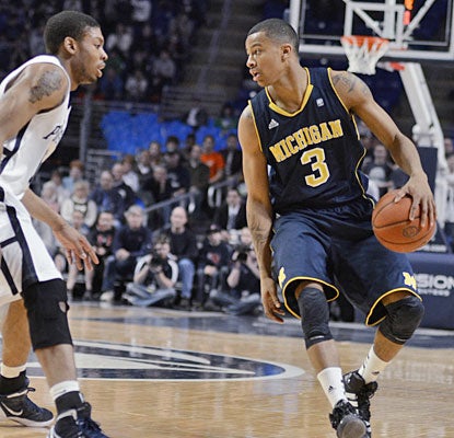 Trey Burke scores 19 as Michigan claims a share of the Big Ten title for the first time since 1986. (AP)