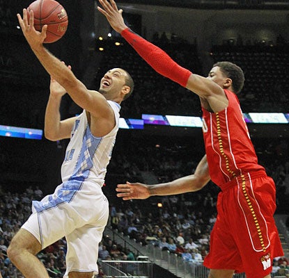 Kendall Marshall runs the UNC offense to perfection, dishing out 12 assists while scoring 13 points.  (AP)