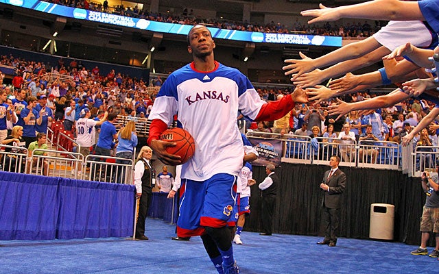 Point guard Tyshawn Taylor sparks Kansas' transition game but is struggling from outside. (Getty Images)