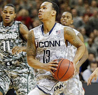 UConn guard Shabaz Napier pours in 25 points as unranked UConn knocks off No. 14 Michigan State.  (AP)