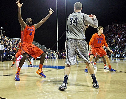 Florida and Georgetown play a full half of basketball on the USS Bataan before the cancellation. (US Presswire)