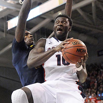 Gonzaga forward Guy Landry Edi tries to go up and around West Virginia's Aaric Murray for a shot in the second half.  (US Presswire)