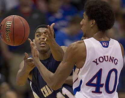 Chattanooga guard Ronrico White knocks the ball from Kansas forward Kevin Young.  (AP)