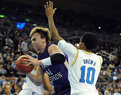 UCLA's Larry Drew II applies pressure to James Madison's Gene Swindle on Thursday night. (US Presswire)