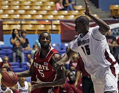 NC State's C.J. Leslie drives by Cady Lalanne of UMass in the Wolfpack's 94-76 win. (AP)