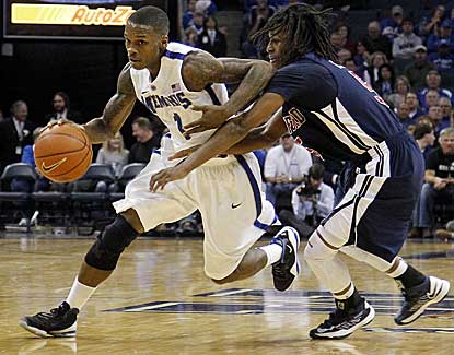 Memphis guard Joe Jackson drives past Samford's Russell Wilson during the Tigers' 65-54 win. (AP)