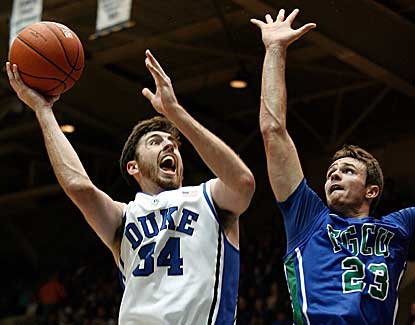 Duke forward Ryan Kelly puts up a shot over FGCU's Eddie Murray in the Devils' 88-67 win.  (US Presswire)