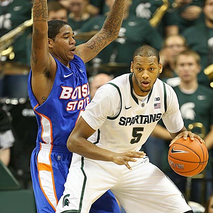 Michigan State center Adreian Payne, shown posting up against Kenny Buckner here, contributes 10 points on 5-of-6 shooting.  (US Presswire)