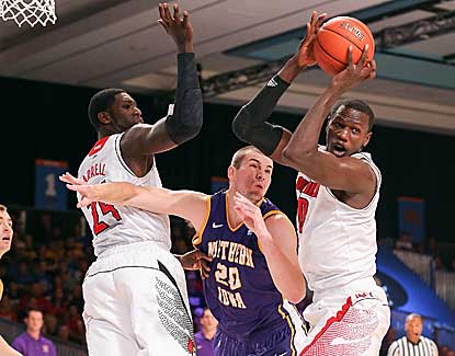 Louisville center Gorgui Dieng, right, battles for a rebound with Northern Iowa's Jake Koch. (US Presswire)
