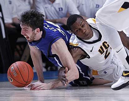 Duke forward Ryan Kelly scraps for a loose ball with VCU's Treveon Graham on Friday in the Bahamas. (AP)