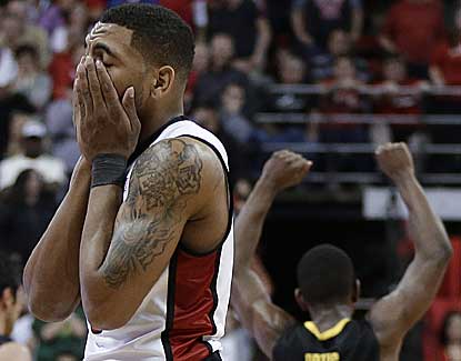 UNLV's Anthony Marshall covers his face after missing a layup late in the Rebels' loss to Oregon. (AP)