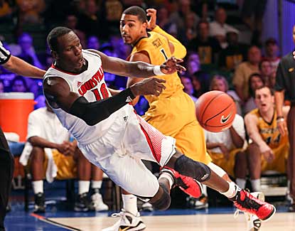 Louisville center Gorgui Dieng saves a loose ball in the Cardinals' win over Missouri. (US Presswire)