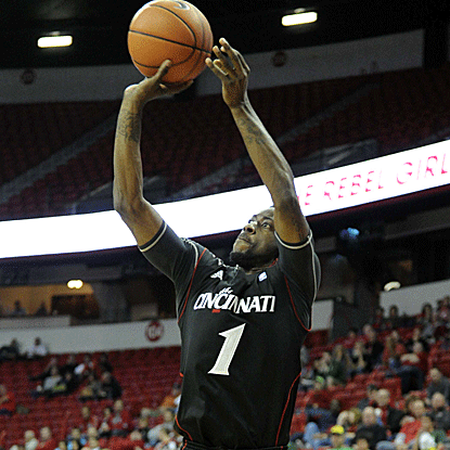 Cashmere Wright connects on five 3-pointers, scoring 17 overall, to lift Cincinnati to the Global Sports Classic title.  (US Presswire)