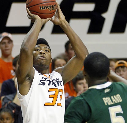 OK State guard Marcus Smart scores a game-high 15 points and also provides six rebounds and five assists. (AP)