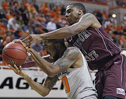 Oklahama State forward Michael Cobbins battles for a rebound with Missouri State's Keith Pickens. (AP)