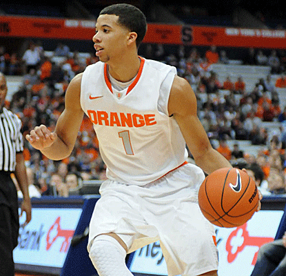 Michael Carter-Williams leads the way with 15 points and a career-high 16 assists in an Orange blowout.  (US Presswire)
