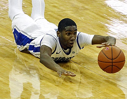 Creighton guard Jahenns Manigat dives for a loose ball against Akron. He also hustles for 2 steals in the game. (US Presswire)