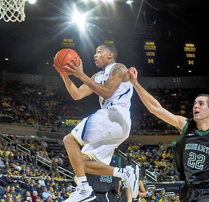 Trey Burke puts up a game-high 19 points to help Michigan improve to 10-0 on the season. (AP)