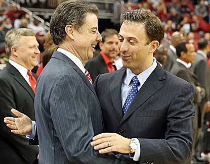 Louisville coach Rick Pitino (left) shares a moment with his son, FIU coach Richard Pitino, prior to tipoff. (Getty Images)