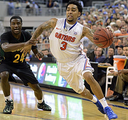 Florida's Mike Rosario drives to the basket for two of his season-high 20 points. (AP)
