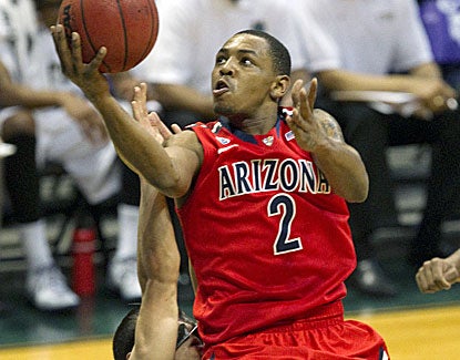 Arizona guard Mark Lyons doesn't shoot the ball well, but he does contribute 4 assists. (AP)