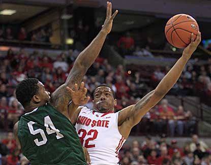 Ohio State guard Lenzelle Smith puts up a shot over CSU's Markus Starks on his way to 13 points. (AP)