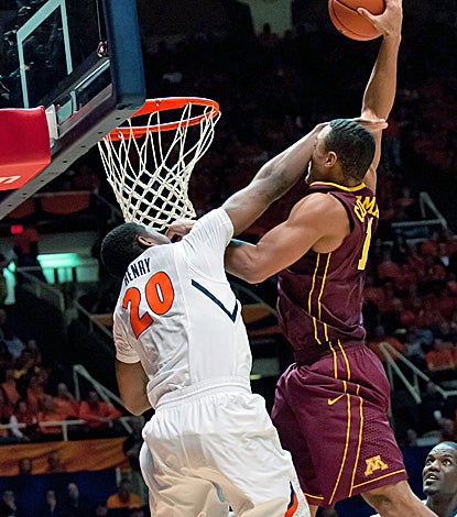 Joe Coleman, who is hit in the face on this shot attempt, finishes with a career-high 29 points in the win. (US Presswire)