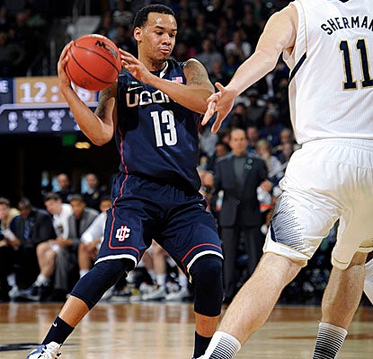 Shabazz Napier provides balance at guard for the Huskies, with 19 points, five boards and four assists in UConn's upset win. (AP)