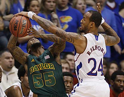 Kansas' Travis Releford (10 points, 2 assists), knocks the ball away from Baylor's Pierre Jackson. (AP)
