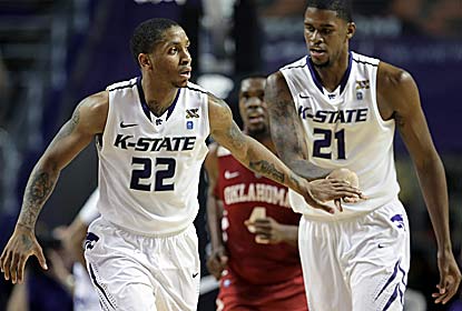 Rodney McGruder (left) -- who scores 20 points -- and Jordan Henriquez celebrate Kansas State's 8th straight win. (AP)