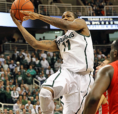Keith Appling scores 15 points and hits a pair of clutch free throws in the closing seconds of a Spartans win.  (US Presswire)