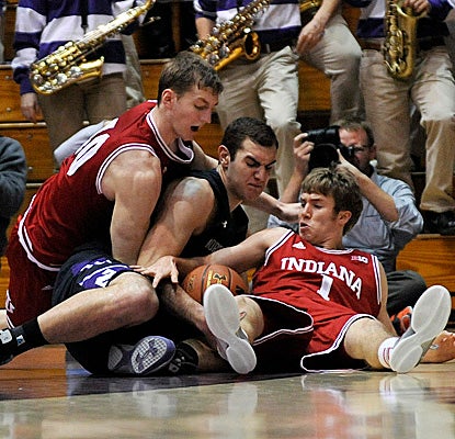 The second-ranked Hoosiers clamp down late after Northwestern three times gets within five points. (US Presswire)