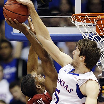 Jeff Withey (13 points, nine rebounds, three steals) goes up for one of his four blocks vs. Oklahoma.  (AP)