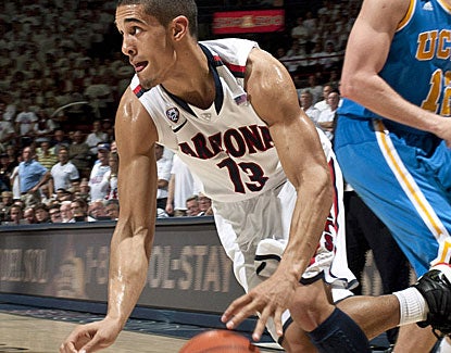 Guard Nick Johnson scores 14 points in just 22 minutes and the Wildcats hold USC to just 28.1 percent shooting. (US Presswire)