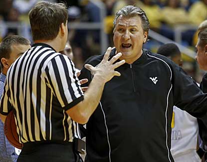 Bob Huggins has his West Virginia charges fired up, but it isn't enough to overcome a slow start against Kansas. (AP)