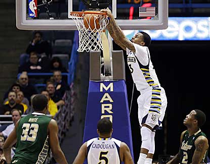 Marquette's Vander Blue throws down a dunk en route to 30 points and a 13-point victory over South Florida. (AP)