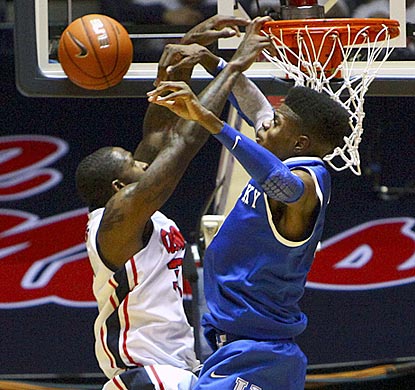 Kentucky's Nerlens Noel records one of his 12 blocked shots with an emphatic rejection of a Murphy Holloway dunk attempt.  (US Presswire)
