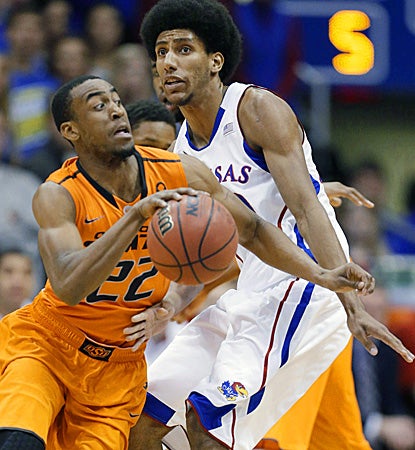 Markel Brown goes in for two of his 28 points as the Cowboys stun the Jayhawks at home. (AP)