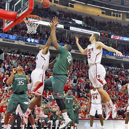 Reggie Johnson (second from right) tips in the winning basket with 0.8 seconds remaining to beat N.C. State in Raleigh. (AP)