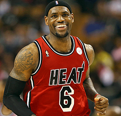 LeBron is a happy man, not just because he scores 30 points, but because he gets to watch the Super Bowl.  (US Presswire)